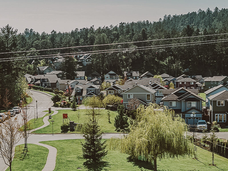 A scenic view of a quiet residential neighborhood in View Royal, featuring well-maintained homes and green spaces, showcasing properties managed by Clover Residential in Victoria, BC