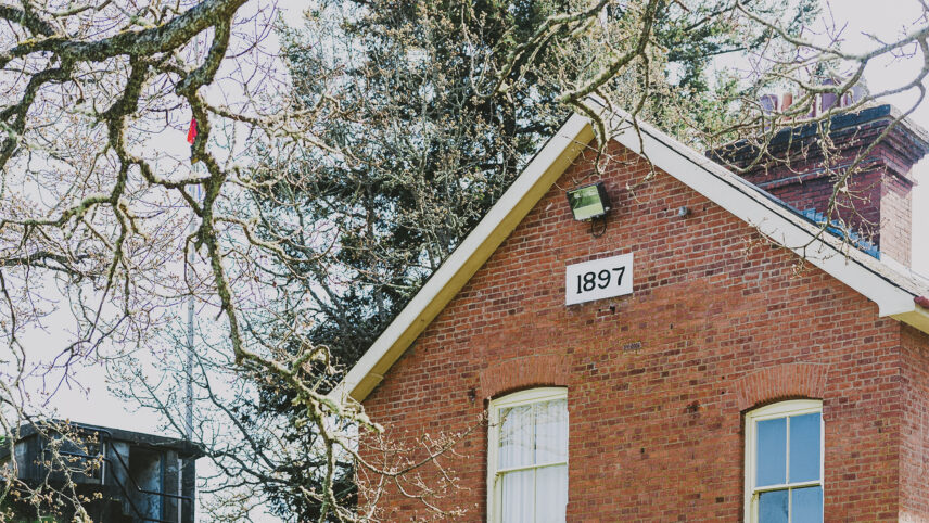 Heritage brick building in Colwood, near Victoria, BC, featuring the year