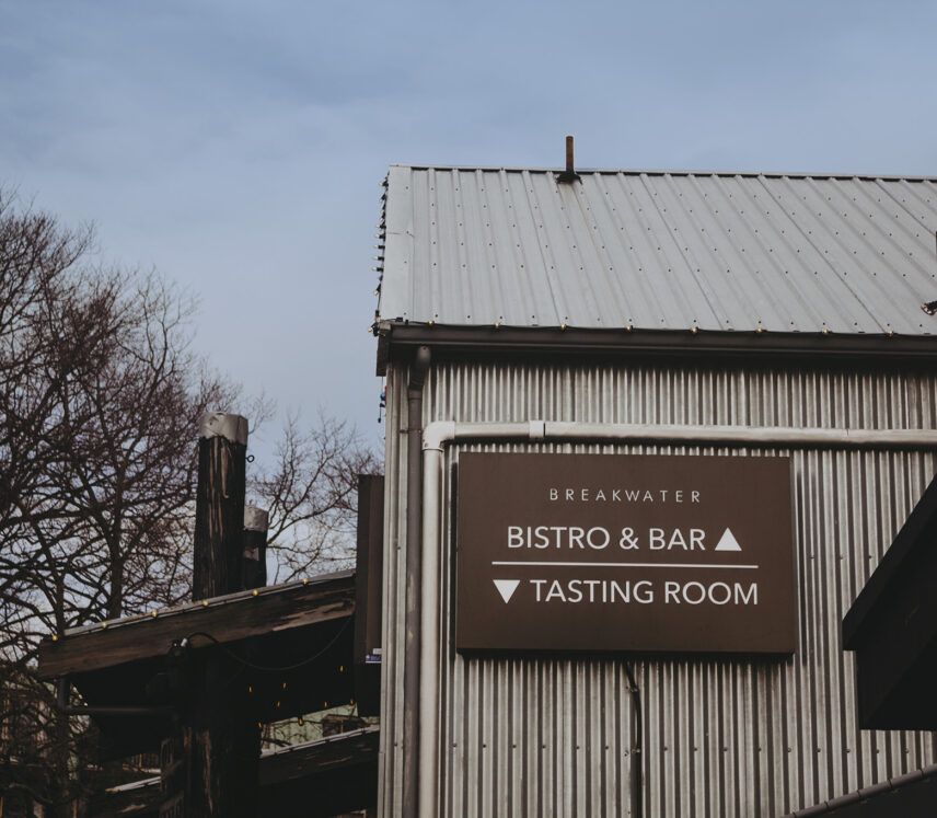 Exterior view of a corrugated metal building with signage for 