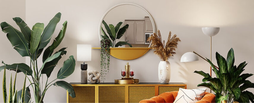 Stylish living room interior featuring a vibrant orange sofa, large green houseplants, a yellow console table, a round mirror, and decorative accents like a white vase and modern table lamps.