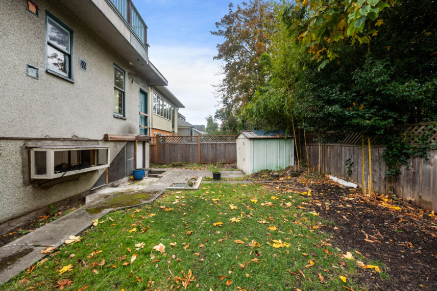 Backyard at 624 Cornwall Street Victoria BC listed by Folio Group at Clover Residential featuring a fenced yard small shed and green space in the Fairfield neighborhood