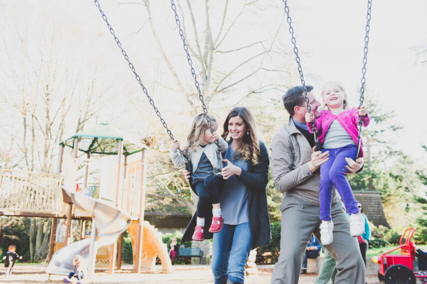 Family enjoying swings at a park in the Fairfield neighborhood
