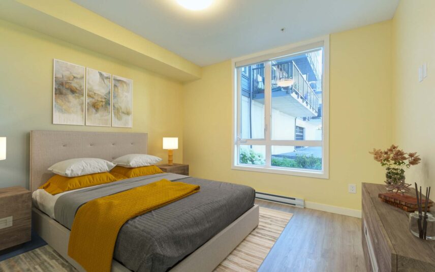 Spacious and modern bedroom with natural light at 101 Presley Place, Unit 110, listed by Folio Group at Clover Residential in Victoria, BC