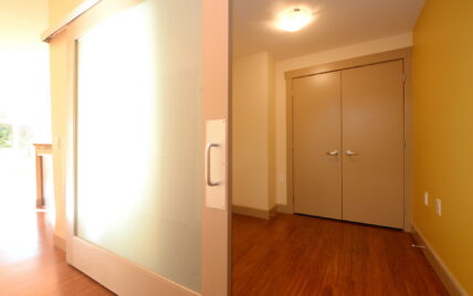 Entryway with frosted sliding door and double closet at 1035 Sutlej Street, Victoria, BC