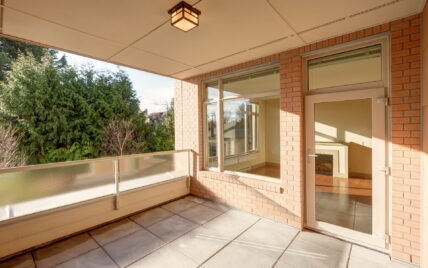 Spacious covered balcony with views of greenery at 1035 Sutlej Street, Victoria, BC