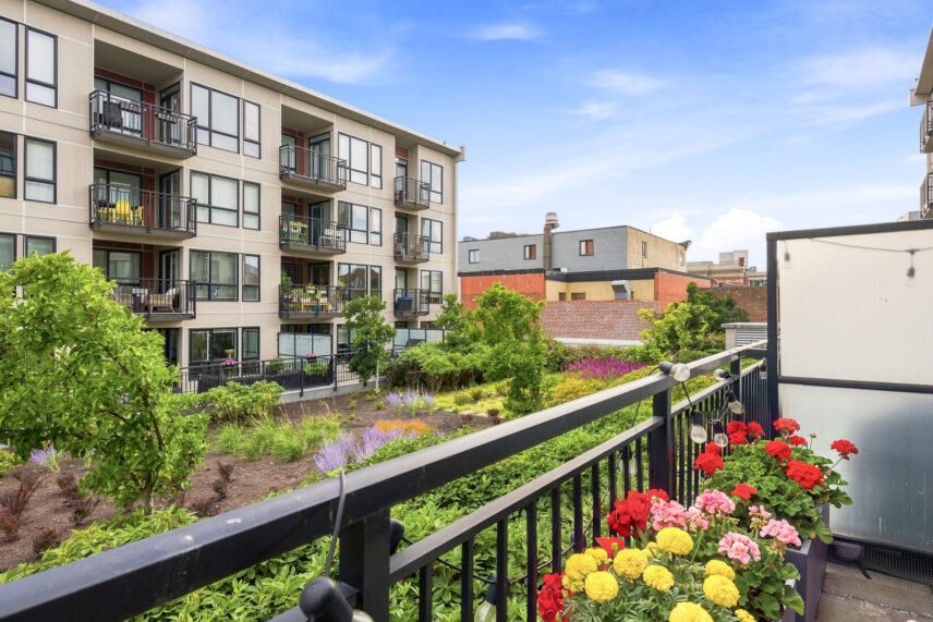 South-facing patio view overlooking landscaped courtyard at The Union condo in Victoria's Chinatown