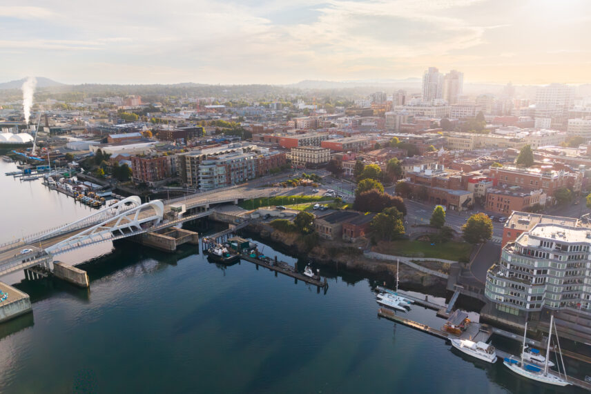 Aerial view of downtown Victoria BC at sunrise showing the Johnson Street Bridge, Upper Harbour and the Chinatown district.